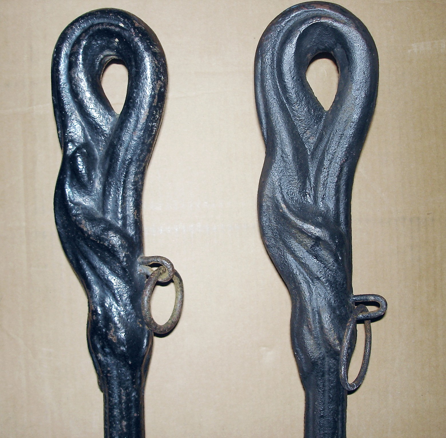 A PAIR OF CAST IRON HORSE TAILS